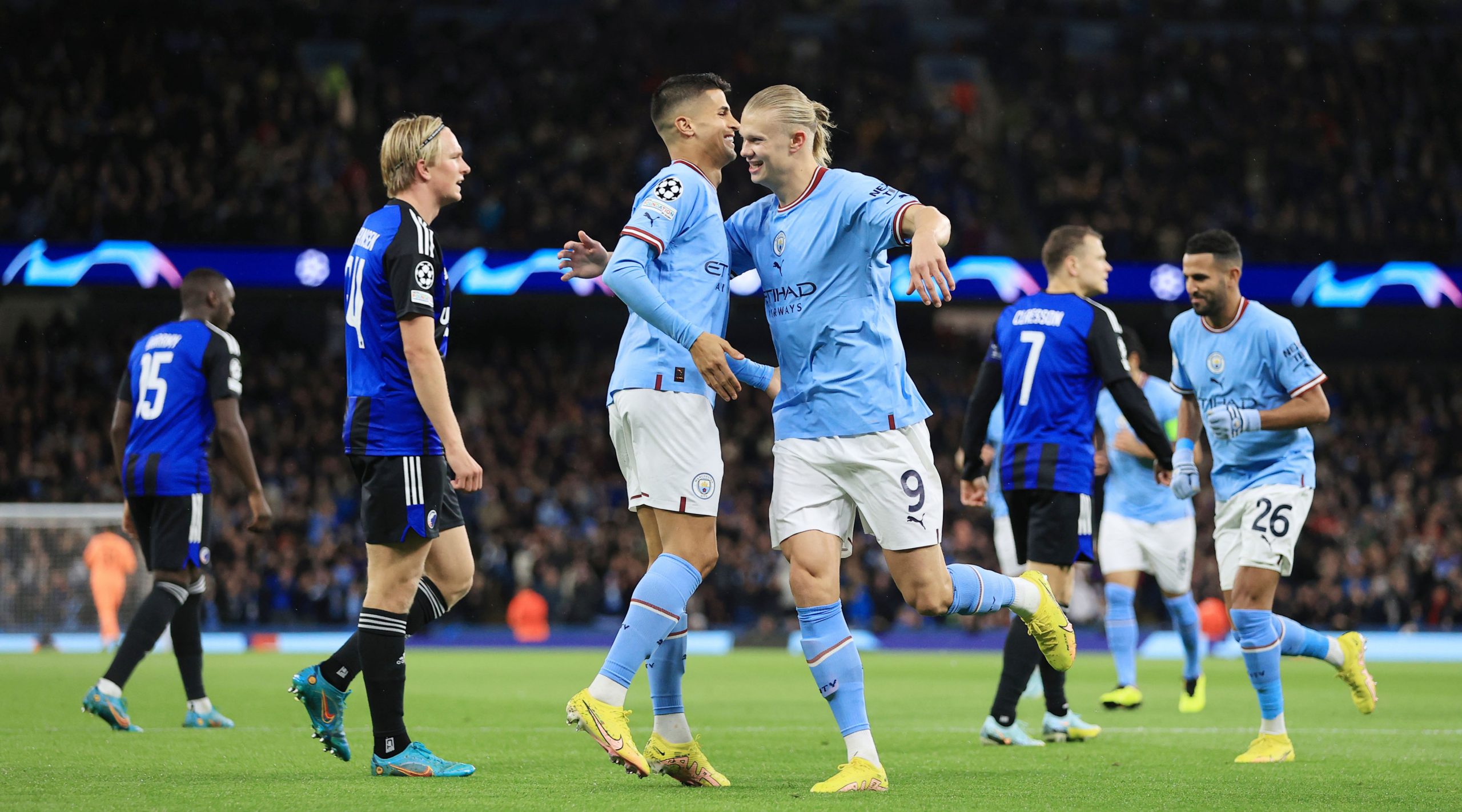 Manchester City players celebrating after the final whistle.